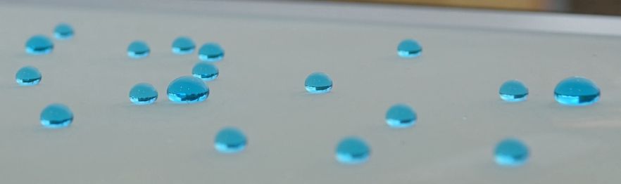 Drops of water on superhydrophobic anti-biofouling and self-cleaning materials