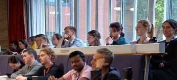 COaCT PhD students attending the Symposium